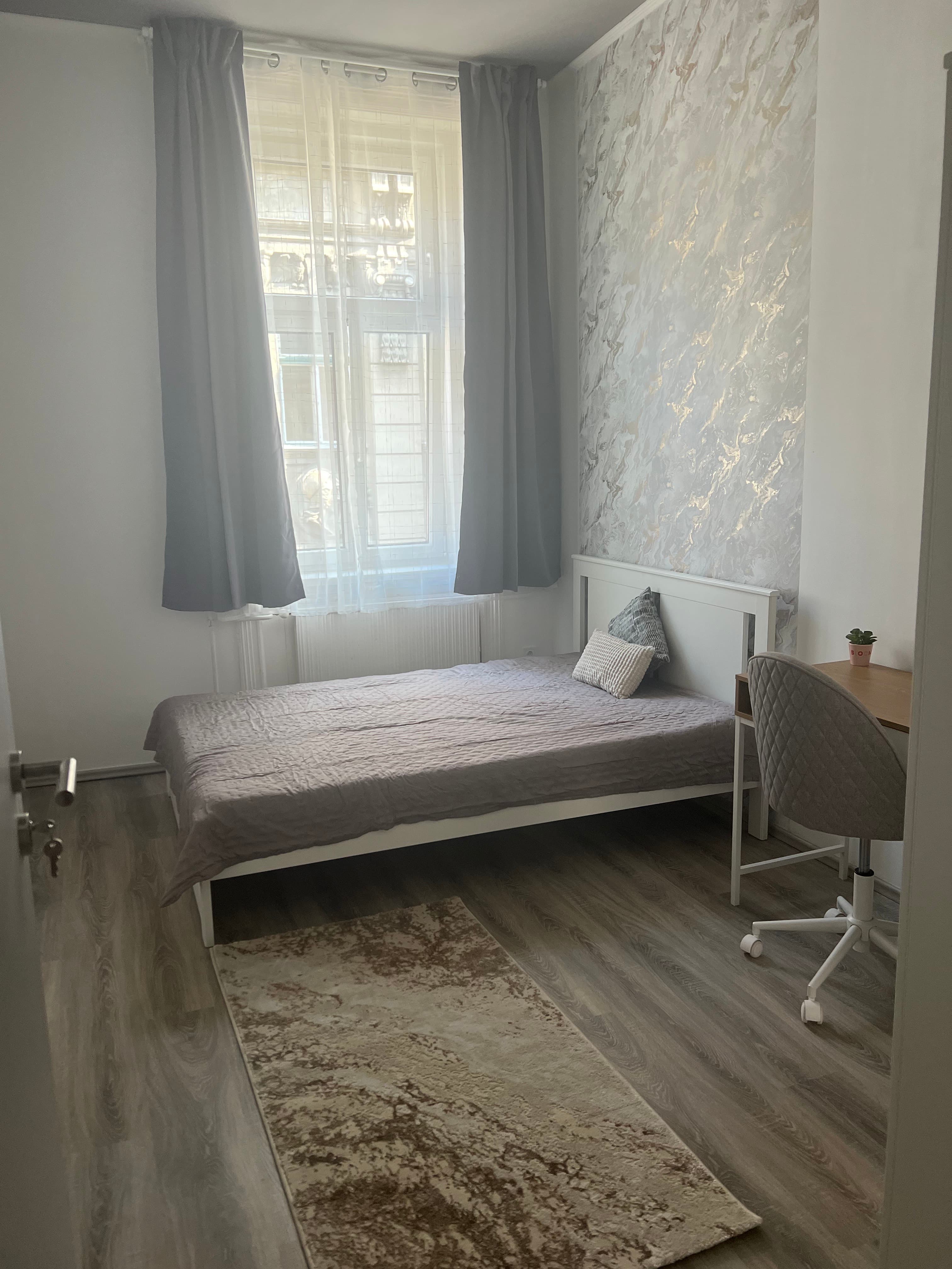 Room 3 overview with bed and workspace