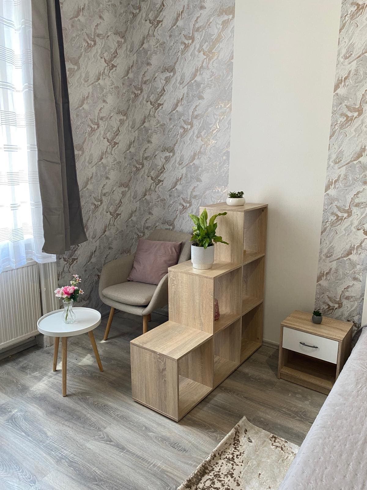 Room 1 angle showing natural light and storage