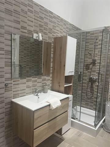 Main bathroom with sink and mirror