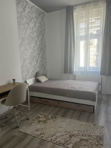 Room 2 overview with bed and workspace