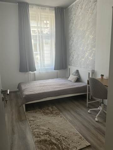 Room 3 overview with bed and workspace